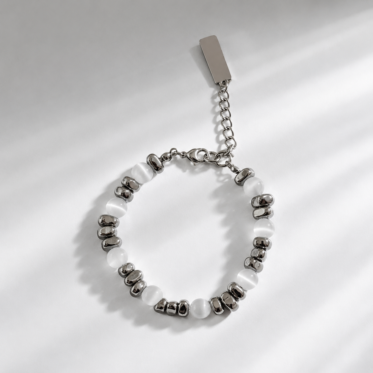 fc8d064c68719eacdfed43e1fe8f4346 White Cat Eye Silver Beaded Bracelet Adjustable Unisex - Image 1